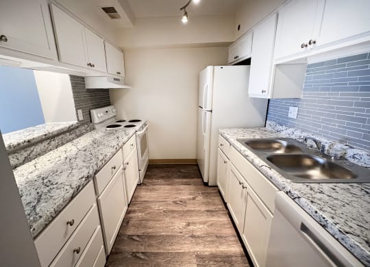 a kitchen with white cabinets at Indian Lookout Apartments, Cincinnati, OH