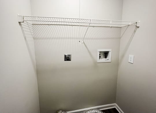a closet in a bedroom with white walls and a white ceiling  at Woodhills Apartments, West Carrollton, OH, 45449