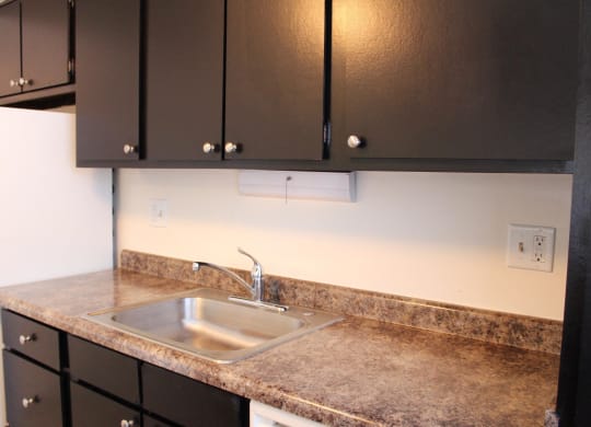 Dark wooden cabinets and counter table at Miamisburg by the Mall, Miamisburg, 45342