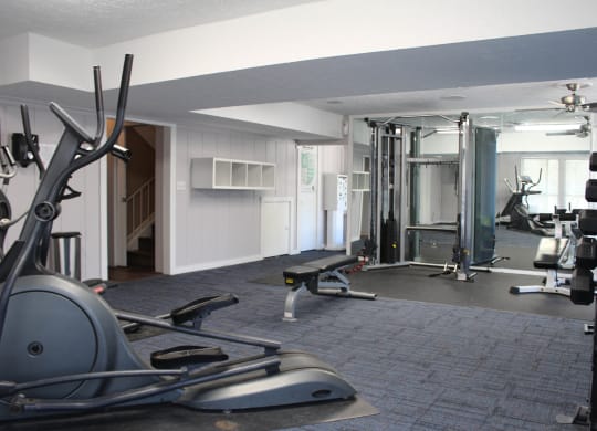 a gym with weights and cardio equipment in a home gym  at Timber Ridge Apartments, Cincinnati, Ohio