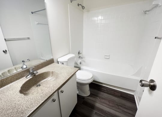 a bathroom with a sink toilet and bathtub  at Hunter's Creek Apartments, Cincinnati, OH