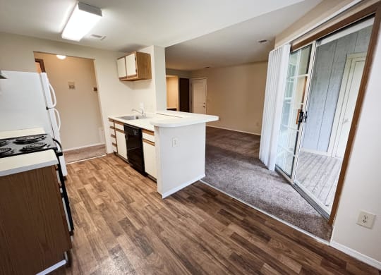 a kitchen and living room in a small apartment  at Woodhills Apartments, West Carrollton