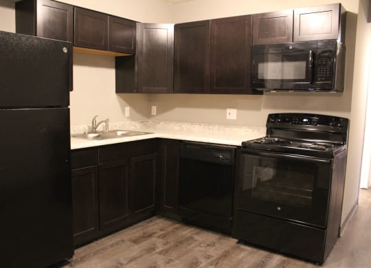 Kitchen with fridge and appliances at Quail Meadow Apartments, Ohio, 45240