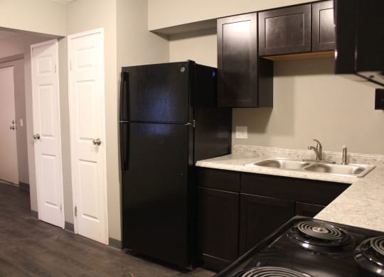 Kitchen with fridge at Quail Meadow Apartments, Ohio
