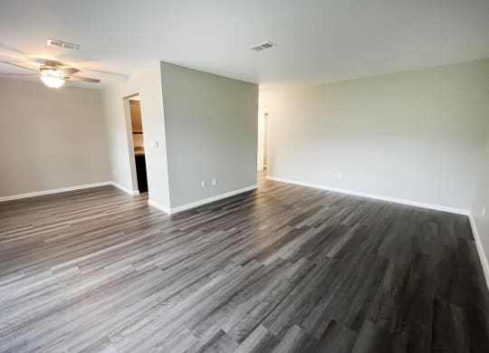 a bedroom with hardwood floors and a ceiling fan  at Timber Ridge Apartments, Ohio