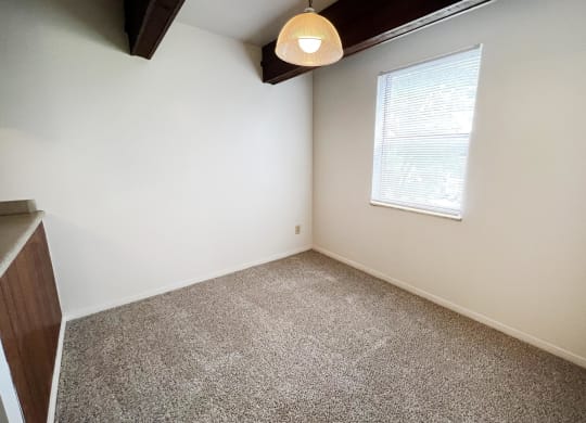 a bedroom with white walls and a window  at Four Worlds Apartments, Ohio, 45231