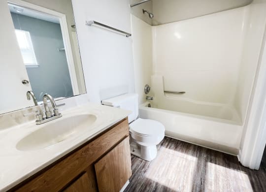 a bathroom with a toilet sink and bathtub at 450 on Keeneland, Richmond