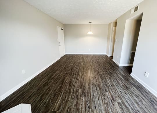 a living room with a hardwood floor and white walls at 450 on Keeneland, Kentucky, 40475