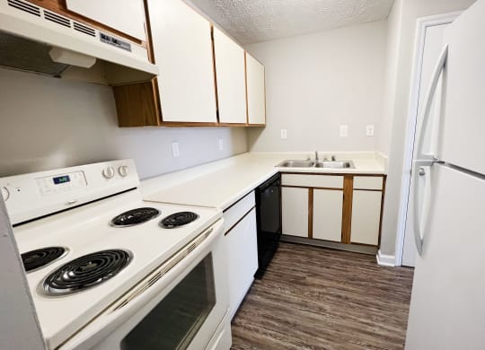 a kitchen with white appliances and white cabinets at 450 on Keeneland, Richmond, 40475