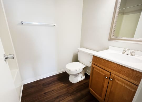 a bathroom with a toilet sink and mirror at 450 on Keeneland, Richmond, 40475
