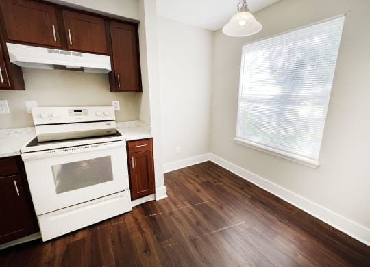 a kitchen with white appliances and wood flooring at 450 on Keeneland, Richmond, 40475
