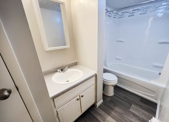 an empty bathroom with a sink toilet and shower at Oakwood Apartments, Florence, 41042