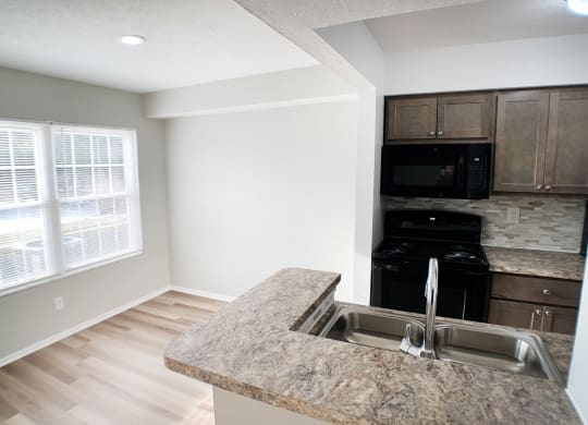 Stainless Steel Sink With Faucet In Kitchen  at Steeplechase Apartments, Loveland, 45140
