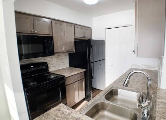 Kitchen Sink With Faucet at Steeplechase Apartments, Ohio