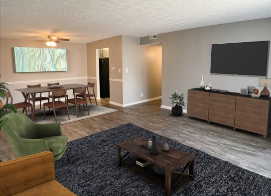 a living room with a tv and a table and chairs  at Knobs Pointe Apartments, Indiana