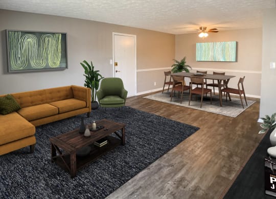 a living room and dining room with a couch and a table  at Knobs Pointe Apartments, New Albany, IN, 47150