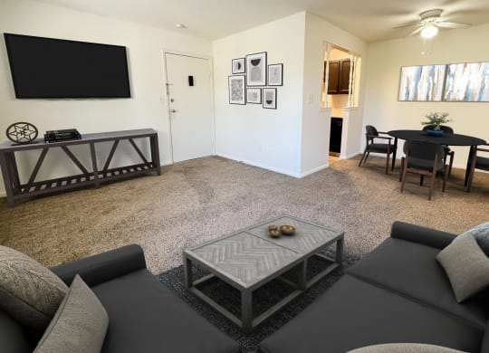 a living room with a couch and a table and a televisionat Revere Village Apartments, Centerville, Ohio