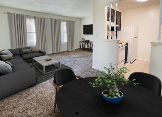 a living room with a table and a couch and a kitchenat Revere Village Apartments, Centerville