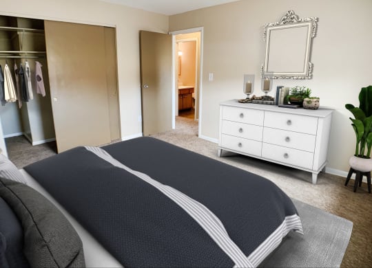 Bedroom with cozy bed with cabinets at Sharondale Woods Apartments, Ohio