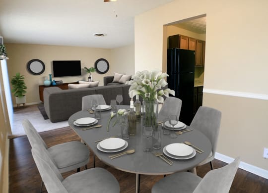 a dining room and living room with a table and chairs  at Timber Ridge Apartments, Ohio