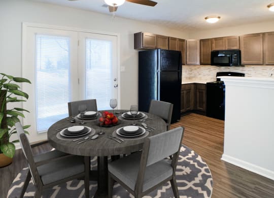 a kitchen and dining room with a table and chairs  at Aberdine Place, Georgetown, 40324