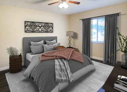 Quail Meadow Bedroom with ceiling fan and light at Quail Meadow Apartments, Ohio