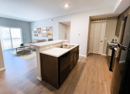 an open kitchen and living room with a couch at Brookfield Village in Grove City 43123