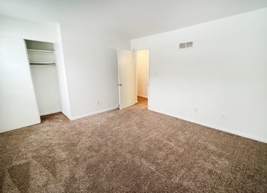 an empty room with carpeting and white walls at Walnut Creek Townhomes, OH