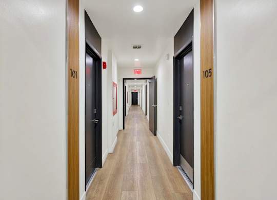 A long hallway with doors 101 and 105.
