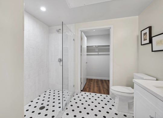 a bathroom with a glass shower and a toilet The Baxter in Los Angeles, CA 90028