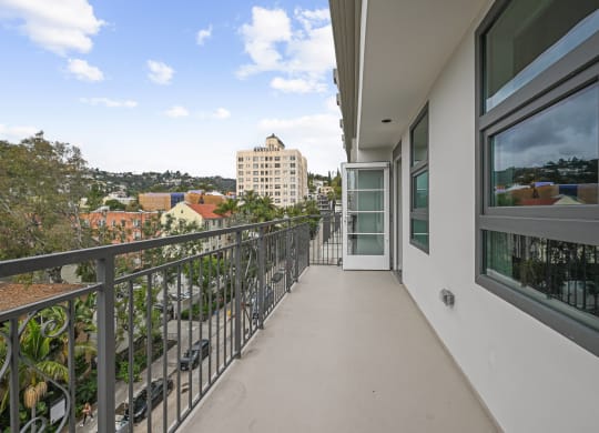 a long balcony with a view of the city The Baxter in Los Angeles, CA 90028