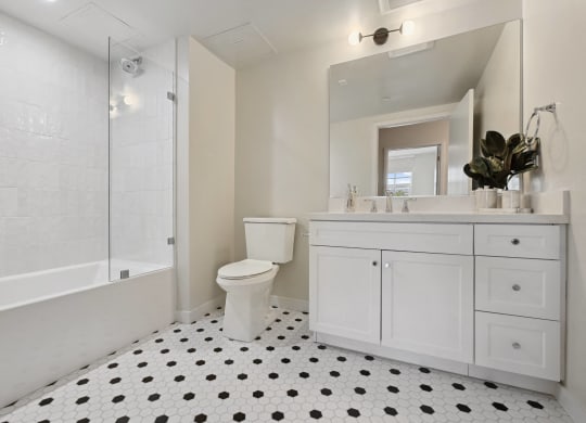 an image of a bathroom with a toilet and a shower The Baxter in Los Angeles, CA 90028