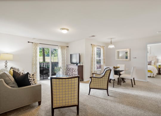 our apartments offer a living room with a fireplace and a dining area at Stonebriar Woods Apartment Homes, Overland Park, KS, 66213