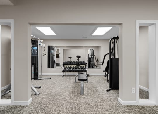 the gym at the enclave at woodbridge apartments in sugar land, tx at Millcreek Woods Apartments, Olathe