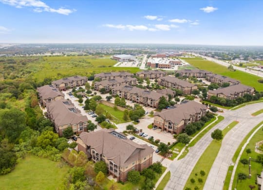 an aerial view of a large complex of houses in a suburban neighborhood