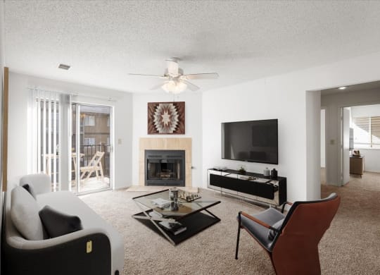a living room with a ceiling fan and a fireplace at Deerfield Apartments, Kansas