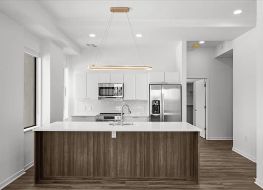 a kitchen with a counter top and a refrigerator