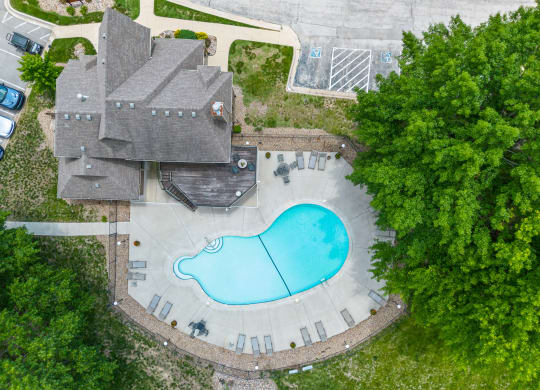 an aerial view of a house with a swimming pool at Waterford Place Apartments & Townhomes, Overland Park, Kansas