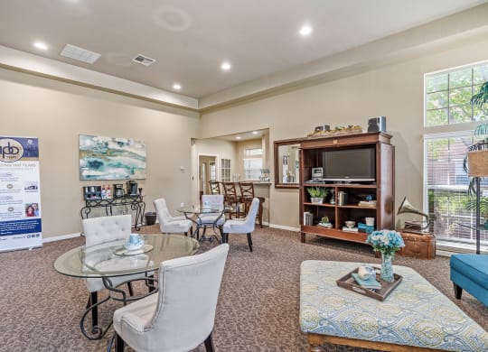 a living room filled with furniture and a large window