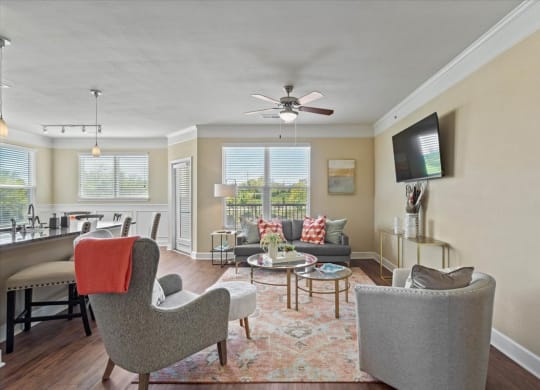 a living room with furniture and a ceiling fan at The Residences at Bluhawk Apartments, Overland Park, KS