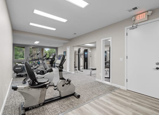 the gym at the whispering winds apartments in pearland, tx at Millcreek Woods Apartments, Olathe, KS