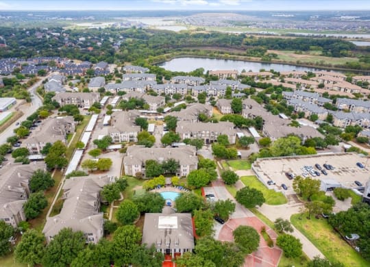 an aerial view of a neighborhood with houses at The Clairborne Apartment Homes, Grand Prairie, Texas