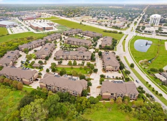 a neighborhood of houses on a grassy field