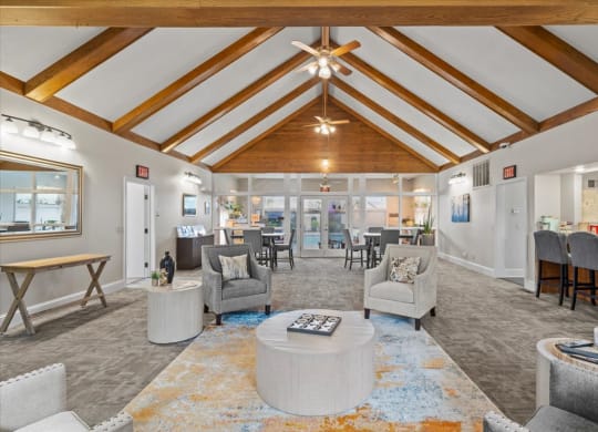 a living room with couches and chairs and a table at Deerfield Apartments, Olathe, Kansas
