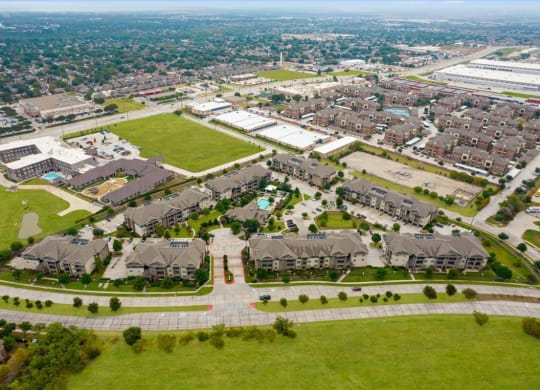 an aerial view of a neighborhood of houses and lawns