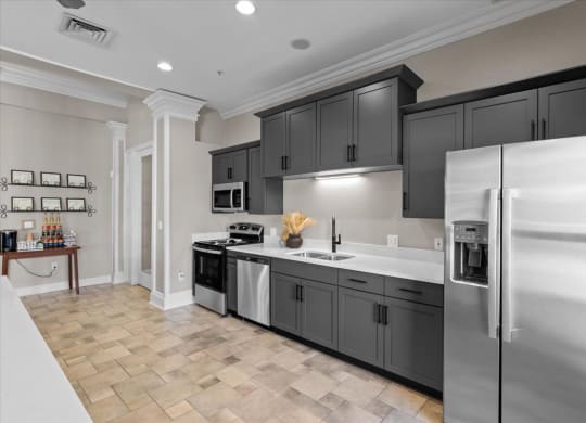 A modern kitchen with a refrigerator on the right.