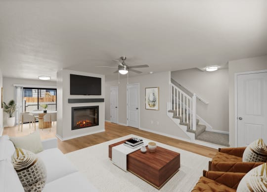 a living room with couches and a table and a fireplace
