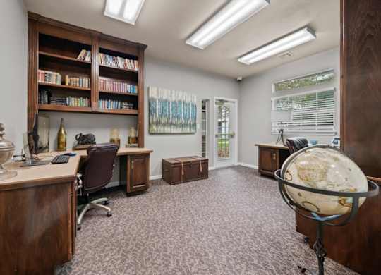 A room with a desk, chair, and bookshelf.at Crowne Chase Apartment Homes, Overland Park, KS, 66210