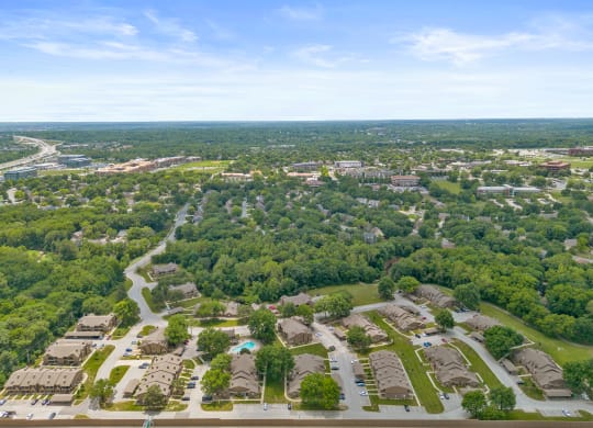 an aerial view of a neighborhood with houses and trees at Waterford Place Apartments & Townhomes, Overland Park, KS