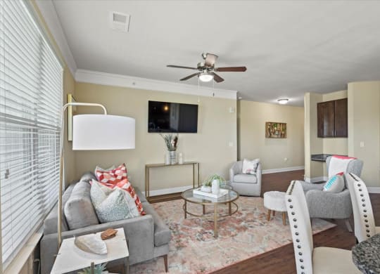 a living room with furniture and a ceiling fan at The Residences at Bluhawk Apartments, Kansas, 66085
